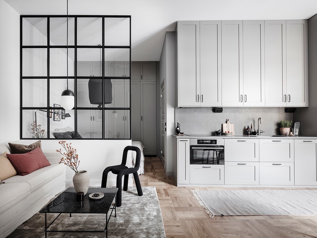 planta abierta pared de cristal decoración mini pisos decoración interiores nórdicos estilo nórdico escandinavo distribución diáfana decoración minipisos cocinas pequeñas grises 