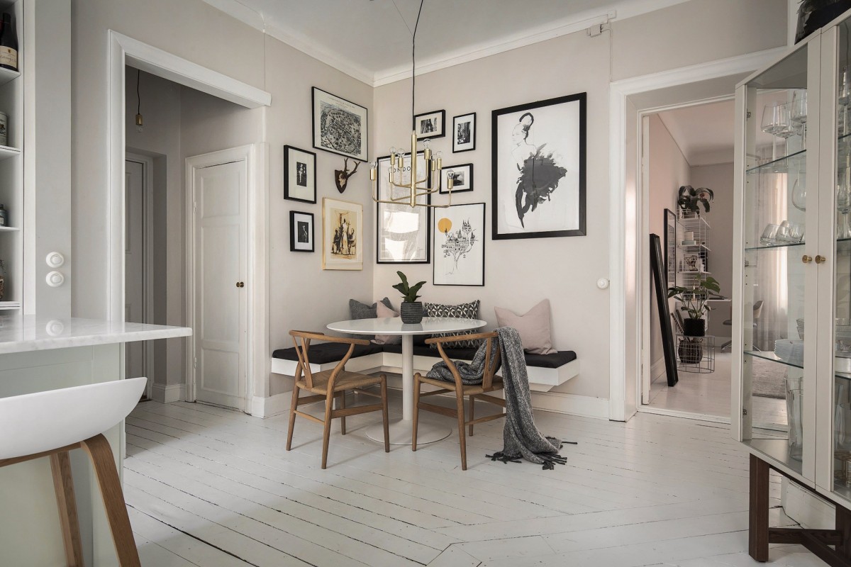 sillas CH24 wishbone de Carl Hansen mesa Saarinen de Knol estilo escandinavo cocinas decoración comedores nórdicos cocina nórdica cocina moderna cocina abierta banco en la pared 
